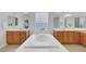 This bathroom features dual sinks and soaking tub at 3728 White Lion Ln, North Las Vegas, NV 89084