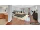 This virtually staged bedroom features a platform bed, hardwood floors, and an attached bathroom at 3728 White Lion Ln, North Las Vegas, NV 89084