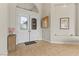 Bright and airy foyer with double doors, tile flooring, and neutral decor at 4624 Leon De Oro Dr, Las Vegas, NV 89129