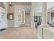 Long hallway with tiled floors, archways, and decorative columns at 4624 Leon De Oro Dr, Las Vegas, NV 89129