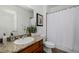 Bathroom features a granite countertop, a tiled shower and tub, and bright lighting at 537 Blanche Ct, Henderson, NV 89052