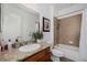 Bathroom features a granite countertop, a tiled shower and tub, and bright lighting at 537 Blanche Ct, Henderson, NV 89052