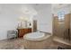 Bright bathroom featuring dual sinks, a walk-in shower, and a large soaking tub at 537 Blanche Ct, Henderson, NV 89052