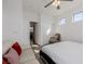 Bright bedroom with white sofa, modern bedframe, and natural light coming in from the windows at 537 Blanche Ct, Henderson, NV 89052