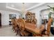 Well-lit dining room showcasing a large wooden table, decorative chairs, and chandelier at 537 Blanche Ct, Henderson, NV 89052