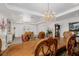 Bright dining room with a large table, decorative chairs, and elegant chandelier at 537 Blanche Ct, Henderson, NV 89052