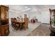 A lavish dining area with decorative wood furnishings, a chandelier, and large windows for natural light at 537 Blanche Ct, Henderson, NV 89052