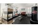 The home gym features a fireplace, modern exercise equipment, and a sleek design at 537 Blanche Ct, Henderson, NV 89052