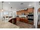 Spacious kitchen featuring granite counters, wooden cabinets, and modern appliances at 537 Blanche Ct, Henderson, NV 89052