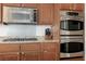 Close up of a gourmet kitchen featuring stainless appliances and granite countertops at 537 Blanche Ct, Henderson, NV 89052