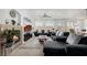 Open living room with a fireplace, large TV, and comfortable seating at 537 Blanche Ct, Henderson, NV 89052
