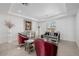 Elegant living room with red chairs, a silver sofa, decorative accents, and soft carpet and white walls at 537 Blanche Ct, Henderson, NV 89052