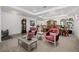 Expansive living area featuring plush seating, elegant decor, and a vintage grandfather clock in a well lit area at 537 Blanche Ct, Henderson, NV 89052