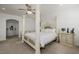 Bright bedroom with a four-poster bed, carpeted floors, and a unique decor at 537 Blanche Ct, Henderson, NV 89052