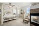 The main bedroom features a fireplace, a four-poster bed, and is connected to the home gym at 537 Blanche Ct, Henderson, NV 89052