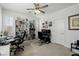 This home office offers a built-in bookcase, a modern desk, and natural light at 537 Blanche Ct, Henderson, NV 89052