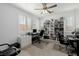 Bright office space features built-in shelving, modern desk, and stylish ceiling fan at 537 Blanche Ct, Henderson, NV 89052