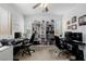 Office space features built-in shelving, modern desk, and stylish ceiling fan at 537 Blanche Ct, Henderson, NV 89052