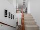 Carpeted staircase with wood railing leading to the upper level of the home at 537 Blanche Ct, Henderson, NV 89052
