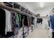 Spacious walk-in closet with custom shelving, rods, and ample storage space for clothing and accessories at 537 Blanche Ct, Henderson, NV 89052