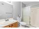 Standard bathroom features a single sink vanity, toilet, and a shower-tub combo with sliding glass doors at 5710 E Tropicana Ave # 1166, Las Vegas, NV 89122