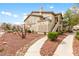 Attractive multi-story condo with well-kept landscaping and exterior staircases to upper units at 5710 E Tropicana Ave # 1166, Las Vegas, NV 89122