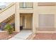 Inviting condo front door with secure screen door, stylish decor, and well-maintained surroundings at 5710 E Tropicana Ave # 1166, Las Vegas, NV 89122