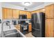 Well-equipped kitchen featuring stainless steel appliances, neutral countertops, and abundant cabinet space at 5710 E Tropicana Ave # 1166, Las Vegas, NV 89122