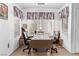 Functional office space with natural light, two chairs, a desk, and window coverings for privacy at 5710 E Tropicana Ave # 1166, Las Vegas, NV 89122