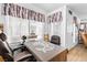 Well-lit office space featuring a desk, window coverings, and neutral-colored walls at 5710 E Tropicana Ave # 1166, Las Vegas, NV 89122