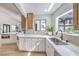 Bright kitchen featuring marble countertops, stainless steel appliances, and ample natural light, creating an inviting culinary space at 5750 Edna Ave, Las Vegas, NV 89146