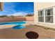 Backyard featuring a pool with a raised jacuzzi and tan concrete patio at 5861 Lakeland Village Dr, North Las Vegas, NV 89081