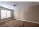 Carpeted bedroom features a double window at 6036 Sierra Lakes St, North Las Vegas, NV 89031