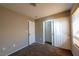 Cozy bedroom with bi-fold closet door, carpet, and neutral walls offering a clean and customizable space at 6036 Sierra Lakes St, North Las Vegas, NV 89031