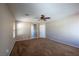 Spacious bedroom boasts neutral walls, plush carpeting, and a ceiling fan for a comfortable atmosphere at 6036 Sierra Lakes St, North Las Vegas, NV 89031