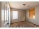 Bright bedroom offers plush carpet, neutral walls, and two windows with wood-style blinds at 6036 Sierra Lakes St, North Las Vegas, NV 89031