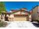 Charming single-Gathering home featuring a two-car garage and a well-maintained front yard at 6036 Sierra Lakes St, North Las Vegas, NV 89031