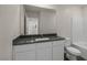 Well-lit bathroom featuring a vanity with solid countertops and a shower-tub combo at 6215 Blood Lily Ave, Las Vegas, NV 89122