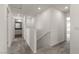 Upstairs hallway with neutral carpet and a hallway bathroom at 6215 Blood Lily Ave, Las Vegas, NV 89122