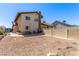View of a backyard featuring a two-story home and rock landscaping at 6320 Peppermill Dr, Las Vegas, NV 89146