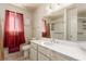 Bathroom featuring a white vanity, large mirror, and shower-tub combo at 6320 Peppermill Dr, Las Vegas, NV 89146