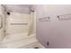 Clean bathroom featuring a shower and tub, grab bars and a shower curtain at 6320 Peppermill Dr, Las Vegas, NV 89146
