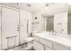 Bright bathroom features a vanity with a sink, a large mirror and tile floors at 6320 Peppermill Dr, Las Vegas, NV 89146