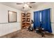 Spare bedroom featuring carpet, blue curtains, a bookshelf, and workout equipment at 6320 Peppermill Dr, Las Vegas, NV 89146