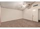 This is a bright bedroom featuring a ceiling fan and neutral walls plus carpet at 6320 Peppermill Dr, Las Vegas, NV 89146