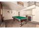 Entertaining game room with a billiards table, wet bar, and unique decor at 6320 Peppermill Dr, Las Vegas, NV 89146
