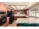 Efficient kitchen with classic cabinetry, tiled counters, and modern appliances at 6320 Peppermill Dr, Las Vegas, NV 89146