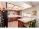 Functional kitchen with tiled countertops and a breakfast bar with seating at 6320 Peppermill Dr, Las Vegas, NV 89146
