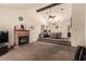 Spacious living room with a brick fireplace and vaulted ceiling at 6320 Peppermill Dr, Las Vegas, NV 89146