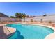 Backyard pool featuring lush turquoise water and raised planters at 6320 Peppermill Dr, Las Vegas, NV 89146